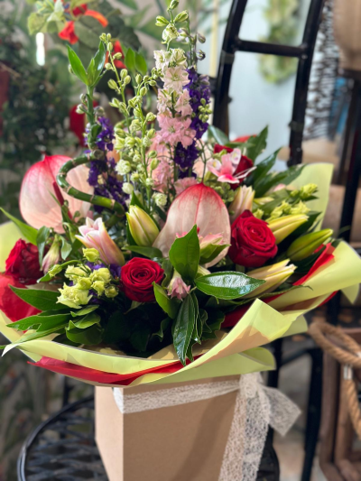 Oh Miss dreamer - Beautiful handtie box of  delphinium roses calla and lilies and anthuriums.
Content may vary depending on availability and season.